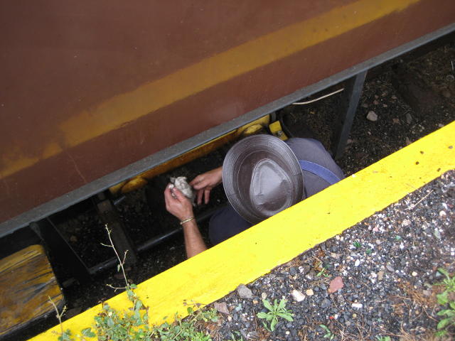 Is the fireman hiding so that the driver can't find him? No, actually Nathan is filling the generator under the bar coach with diesel