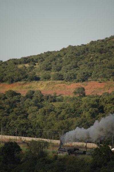 Steam on the Johannesburg main line. Class 19D 2650 heads towards Germiston en route to collect a GMAM garratt for storage at FOTR's site in Pretoria. It has been a long time since steam has traversed this section. Pictured here on the section towards Fountains station, viewed from UNISA campus building.