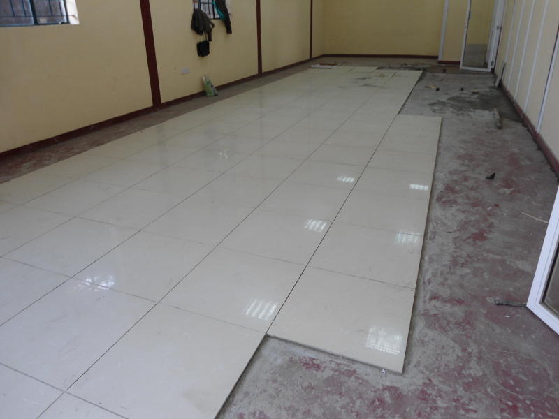 Floor tiles being laid in the new lecture theatre