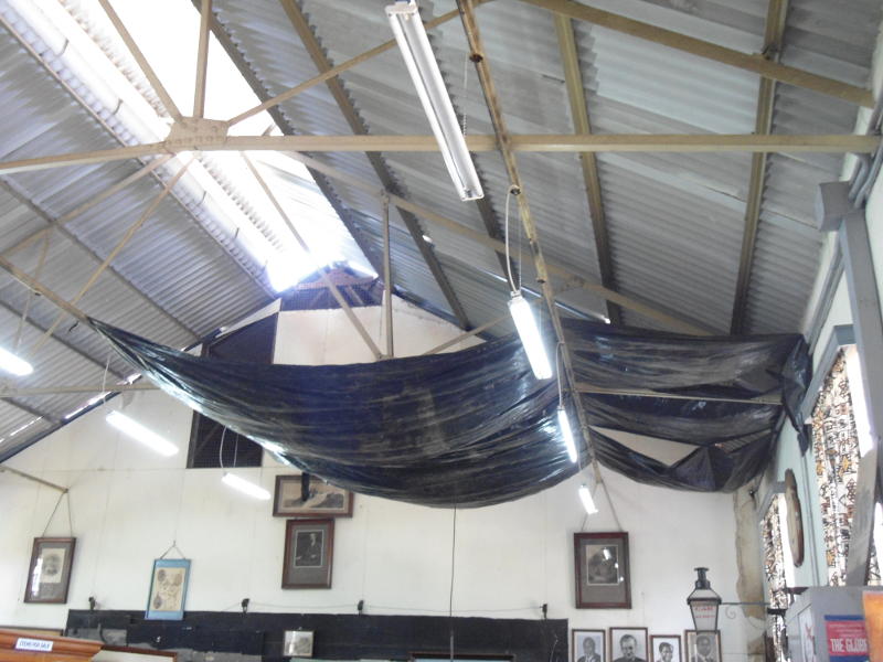 In the old part of the museum, asbestos roofing is being removed and replaced