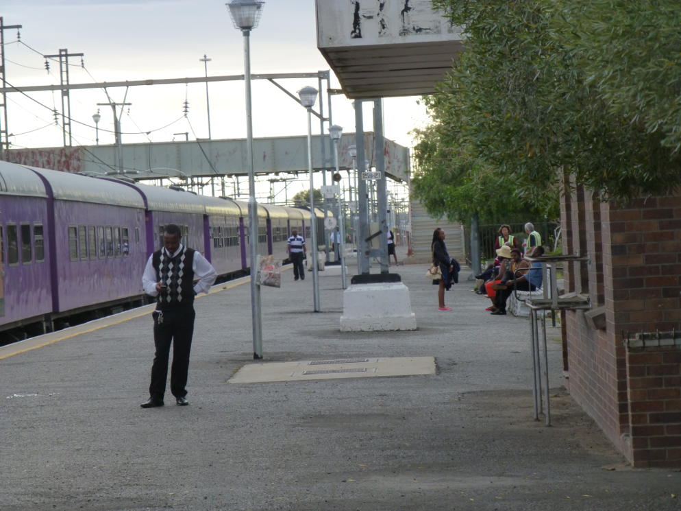 Passengers and PRASA personnel wait for departure