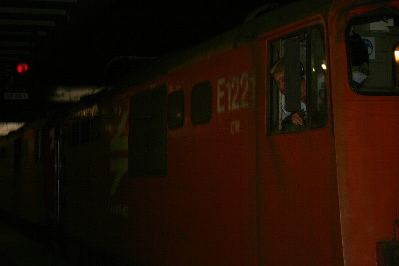 Driver of the 6E poses behind his mirror.