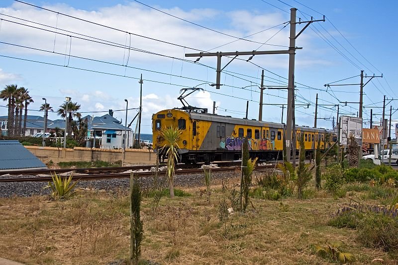 The last coaches of this train passing just the railway crossing in Kalk Bay.