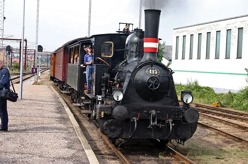 The small engine arrives with a special train.