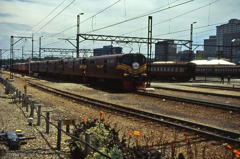 Ten or eleven electric locomotives are waiting for the next job.
