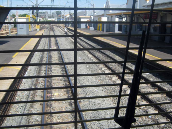 View from the drivers seat of Braamfontein Station as someone runs across the tracks