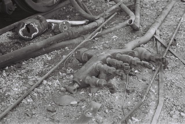 Steam turret on the ground, the brass will be collected and dumped in a bin, separate from the boiler, it once adorned.