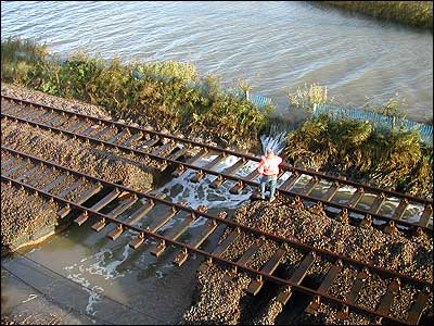 Ballast was washed away from underneath the rail track by flood water at Haddiscoe Bridge, November 2006