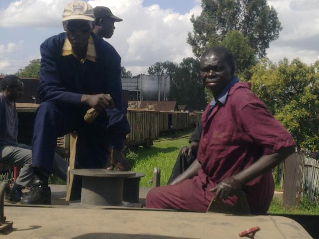 Some of the steam team ride on the tender