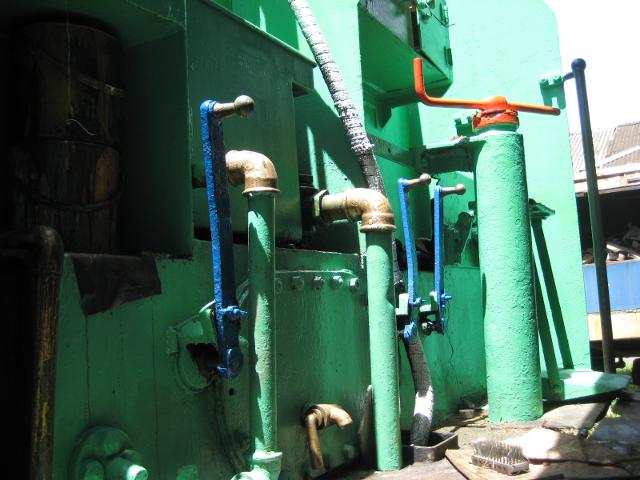 The water cut-off cocks from the tender, painted blue, are accessible from the footplate. You don't have to climb down and rummage under the tender with a heavy hammer as you do in South Africa!