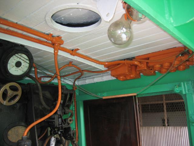 Looks a bit like the Irish flag: green (cab sides), white (roof) and orange (electrical)