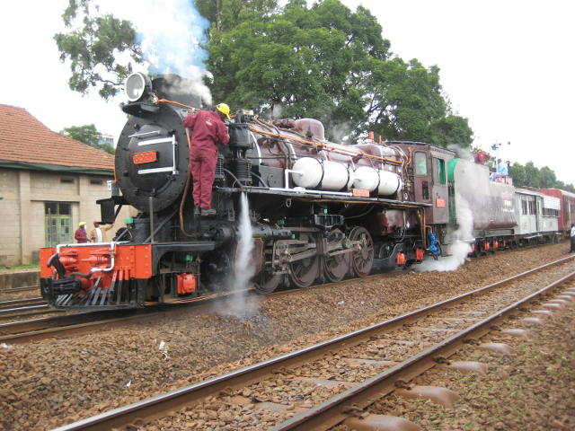At last, 3020 has a TRAIN, rather than being a light locomotive. A diesel has just set back and delivered the consist. Meanwhile the air pump gets a bit more attention.