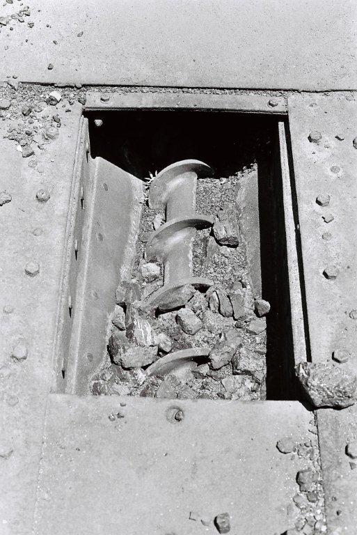 The mechanical stoker worm gear in the coal trough inside  the tender. This would turn and draw the coals forward toward the firebox, breaking it into smaller pieces before being delivered onto the distribution table in the firebox