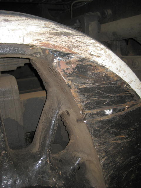 The balance weight on one of the driving wheels has been scraped and damaged
