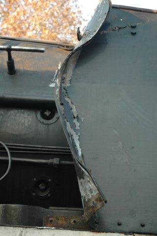 Driver's side smoke deflector damaged by the breakdown crew with their steel cable slings.