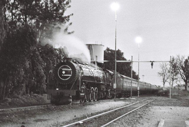 Unfortunately low light and a hand held shot of this CA standing under the water column at Cullinan, spoil the photo somewhat, but this was the regular procedure with this train set. Afternoon arrival at Cullinan, the coaches were stabled here, whilst the loco returned with a goods to Pretoria. Later that night, a goods working to Cullinan and that loco then returned with these coaches. If quick enough on the shunt, then there could be lots of sleep time under the column!