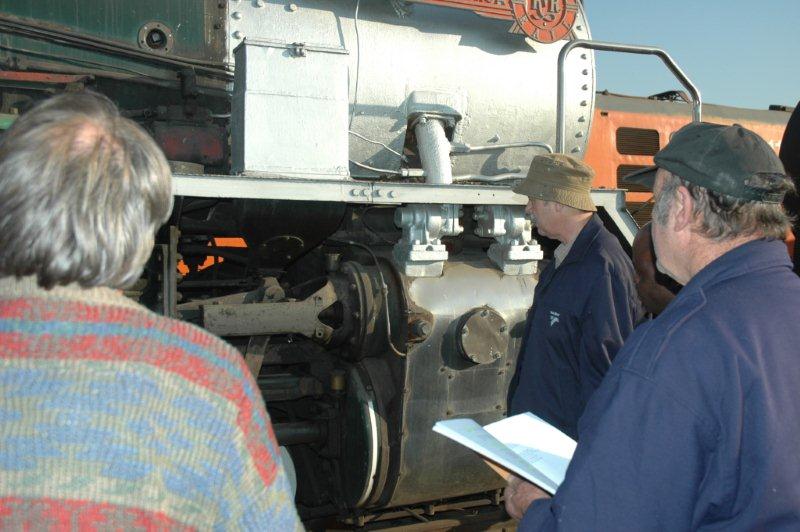 Attentive pupils listen to the lecturer on how to centralise a valve.