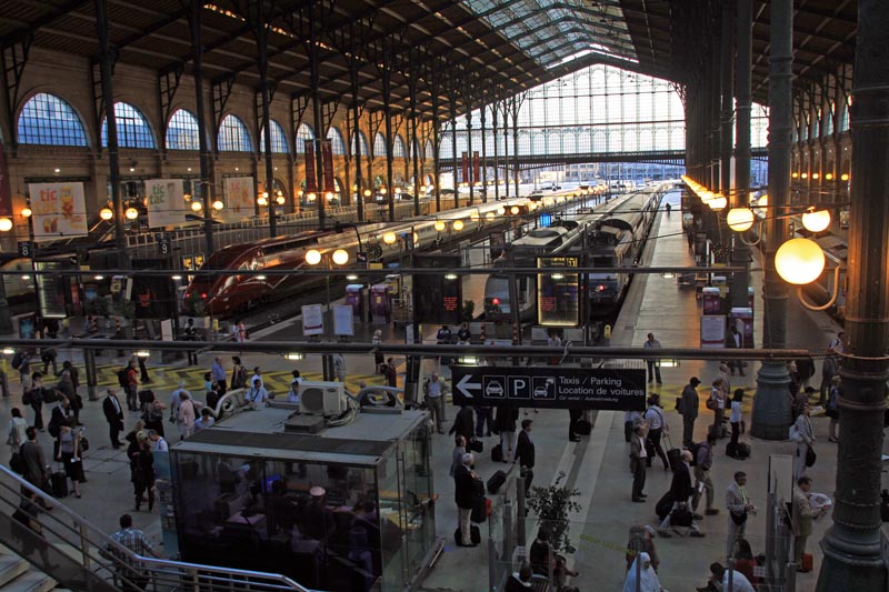 View of the Gare d' Nord in Paris. Multicloured bullet trains ready to fly off to the north!