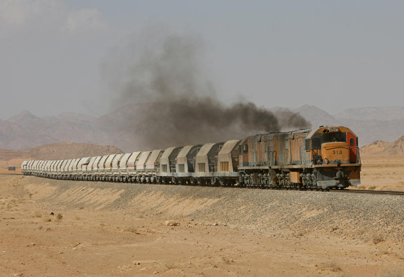 Aqaba Railways Corporation loco's 313 and 963 climb hard through the Wadi Rum protected area on 25-10-2009 on their way to the Hedjaz Loading terminal.