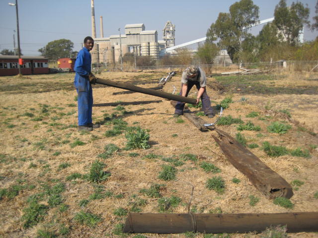 Old sleepers are laid out to mark the limits of the future passenger car park at the eastern end of the site. Round wooden poles will be used to make a fence, probably with chains between them