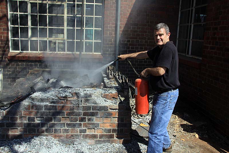 Steve Smith showed his face and was happy to extinguish this refuse dump fire, as he tested and gave instruction in the use of fire extinguishers.