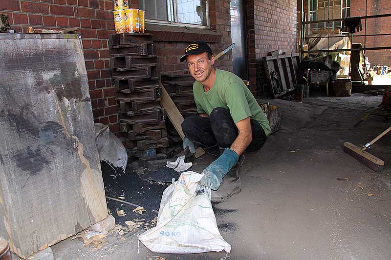 Chris manages a smile in between store spring cleaning