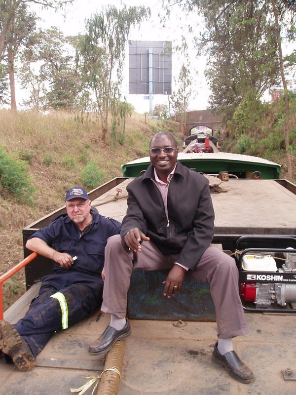 John reclines on the tender with Isaac Murage, a senior controller and diesel driver with RVR. Best seat in the house, but you can't do this on lines with overhead wires! Photo by Erik Forsman, a Swedish railway enthusiast who rode with us
