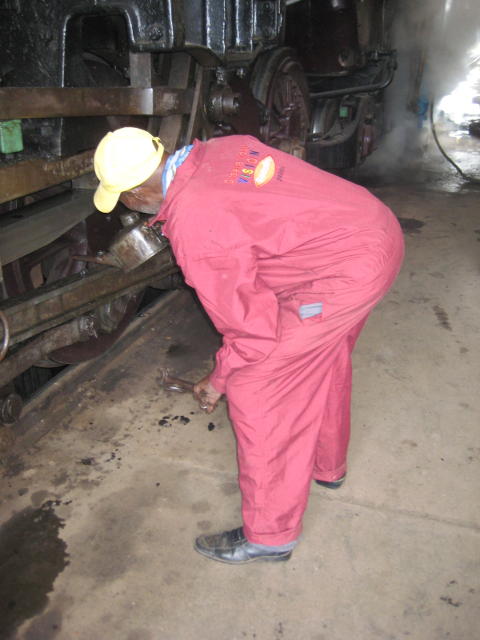 A timeless scene - driver Ben oils his steed