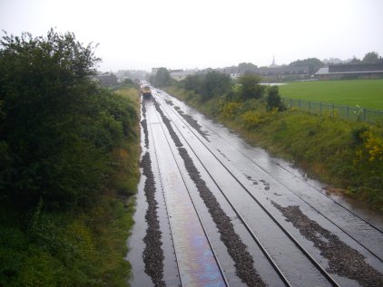 First Great Western High Speed Train (HST) with the water just about at rail level, at a stand at a signal close to the Alstone Lane level crossing in Cheltenham, July 2007