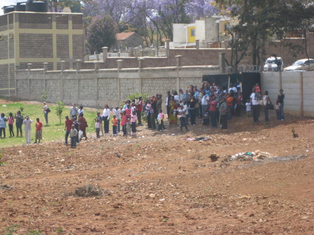 Passengers await the train at Mawenzi Gardens