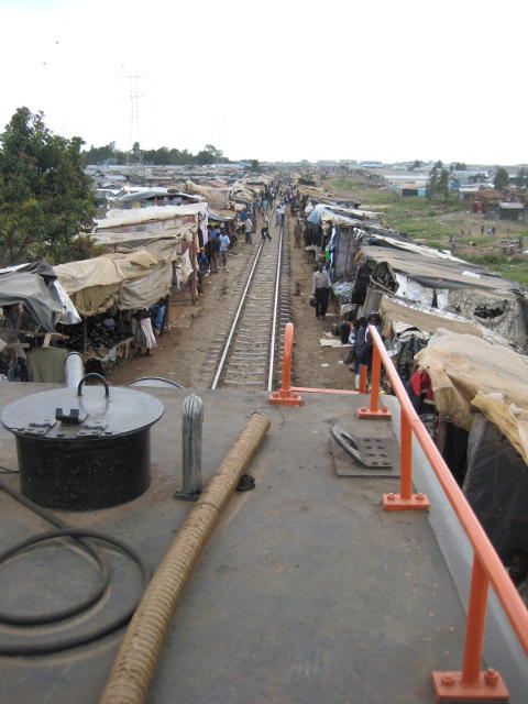 People on the track ahead and very little clearance at the sides