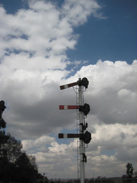 Lower quadrant signals in the yard. Believe it or not that slightly drooping top signal is off, giving us the road