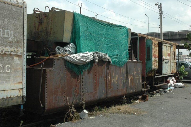 Disused loco tender at shed entrance with other withdrawn railway products.