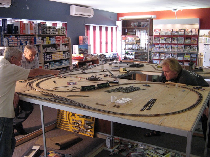 First test run! From left to right - Eric points out a "bump", while Paul looks on and Jorg studies the stock.