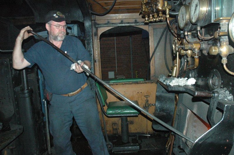 "Here, let me pull it out"<br /><br />The work of a Fireman is about preparation. The early morning getting the sleepy firelighter's fire pushed forward to raise steam, and then the daily task of readiness can continue.