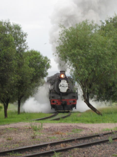Steaming up the hill towards the gate