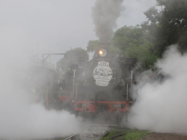 2650 departs in a cloud of steam early on a wet and dull morning