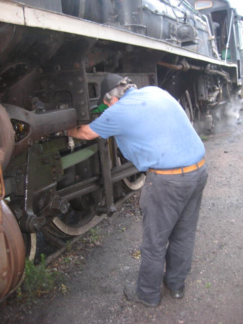 Tony lubricates the locomotive