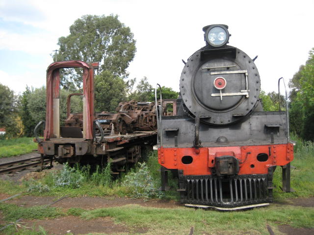 3664 is back in steam on 11th for the first time after a long break for boiler recertification. Her first duty was rather unglamorous - shunting. Here she stands at the eastern end of the site next to damaged Rovos Rail vehicles