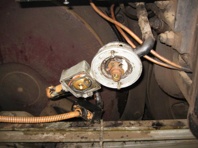 An electrician is working on 5918. This is one of the lights under the loco.