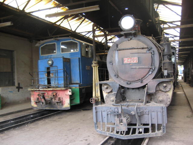 What's that diesel doing in our shed? 4724 stands alongside 2409 in shop 006, which has become the steam shed.