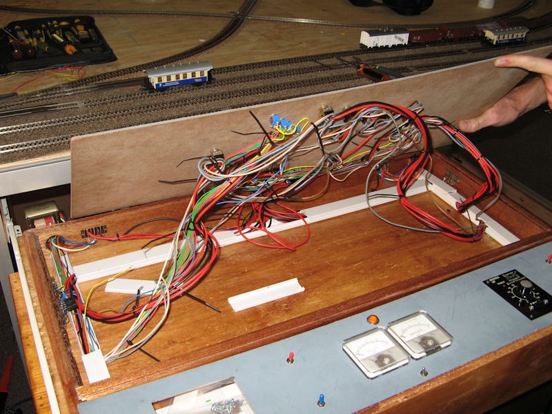 The back of the control panel lifted to shown the wiring to the point or switch controls.