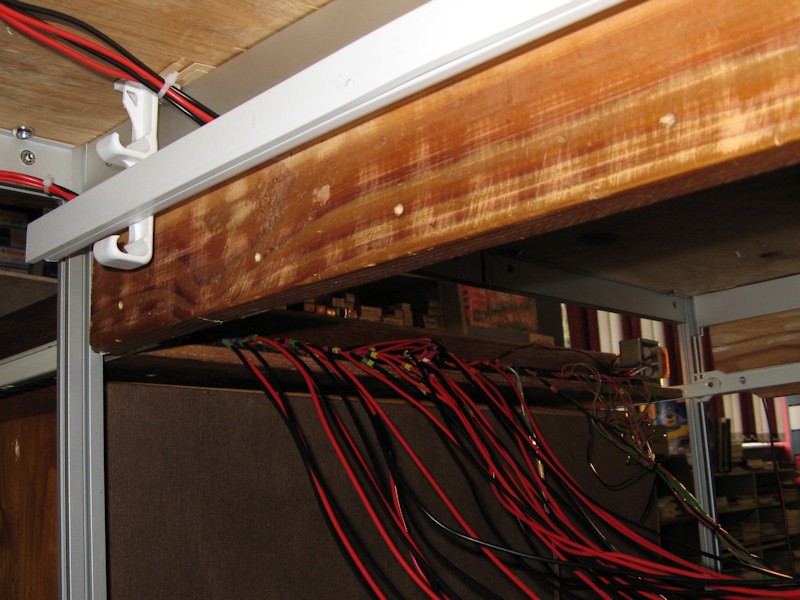 Under the table looking at the wiring going into the back of the control panel.