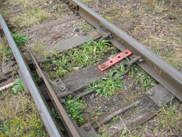 The points at both ends are spiked to prevent access to the line under repair