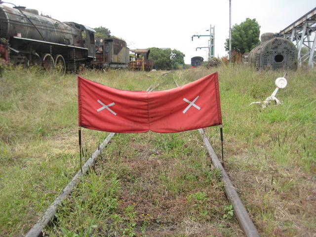 The track work is protected by red banners, this one at the eastern end