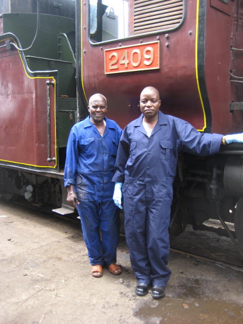 Museum Curator Maurice Barasa (right) wears an overall for this part of his work. With him is retired boiler maker Wilson, brought back for the occasion