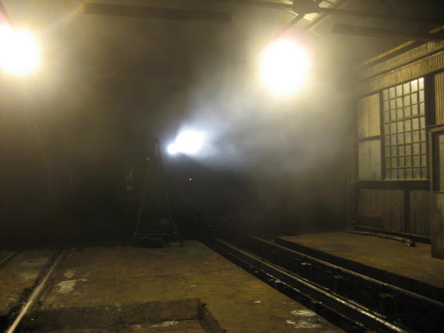 Something big and powerful is making its way out of the gloom into the floodlit shed...