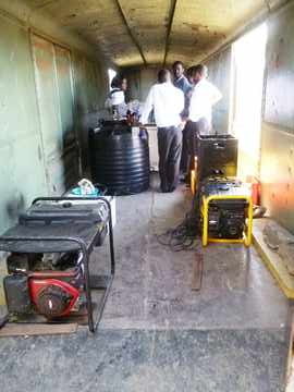 A very effective kitchen was set up in a motorail van, complete with two generators, a refrigerator, a microwave oven, various storage containers, and friendly staff.