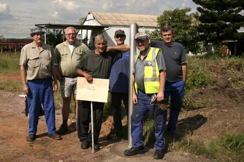 L to r Brian, Tom, John D, Nathan, John A and Steve S pose by the new gate post