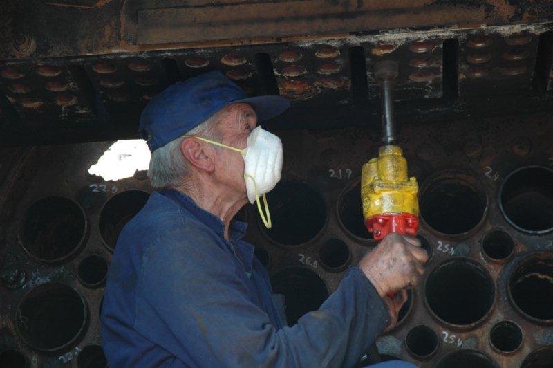John Dadford doing some really muscle taxing tasks of polishing the header prior to the elements being fitted.